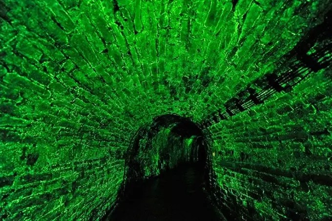 The mystery of the green glow of the walls in this corridor has been partially solved.
